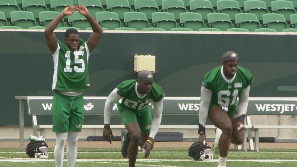 Rookie receiver Ajou Ajou, centre, will try to make an impact with the Saskatchewan Roughriders.