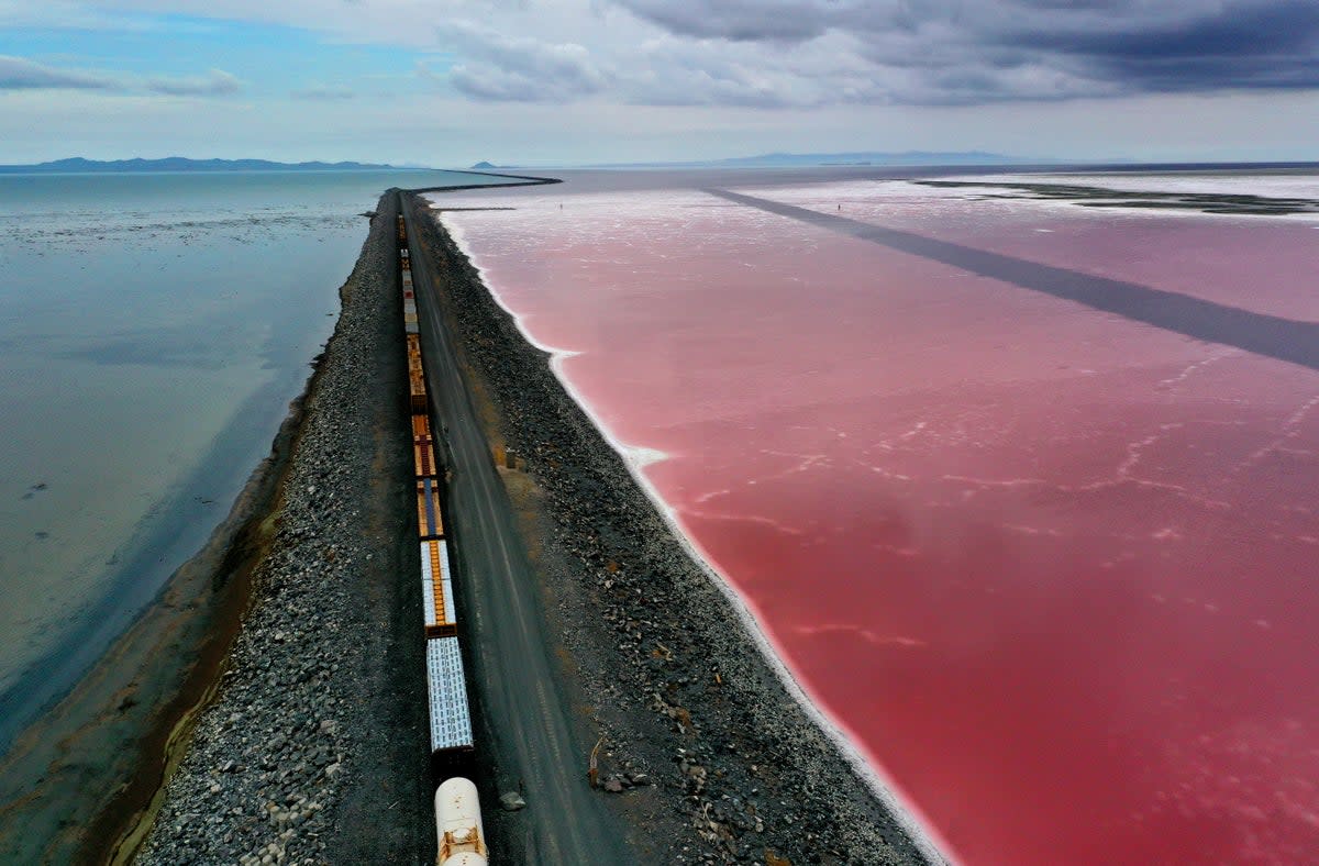 A railroad causeway divides the Great Salt Lake in August 2021 near Corinne, Utah. As severe drought continues to take hold in the western United States, water levels at the Great Salt Lake, the largest saltwater lake in the Western Hemisphere, have dropped to the lowest levels ever recorded (Getty Images)