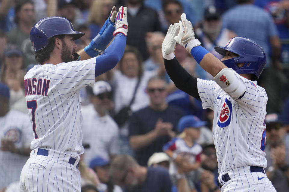 Chicago Cubs' Seiya Suzuki, right, of Japan, celebrates with Dansby Swanson after hitting a two-run home run during the fourth inning of a baseball game against the Colorado Rockies in Chicago, Friday, Sept. 22, 2023. (AP Photo/Nam Y. Huh)