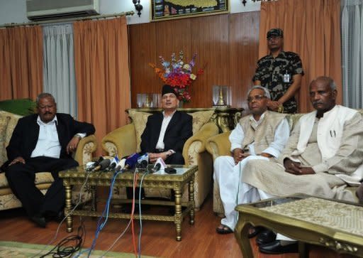 Nepalese Prime Minister Baburam Bhattarai (2nd left) answers questions during a press conference in Kathmandu on May 27. The leader of Nepal's Maoists has called for rival parties to join a national unity government to take the country to fresh elections and said he was open to a change of prime minister