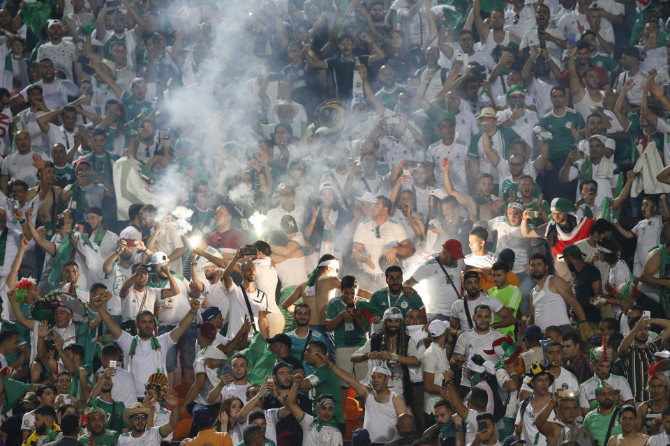 Algerian fans celebrate after the African Cup of Nations final soccer match between Algeria and Senegal in Cairo International stadium in Cairo, Egypt, Friday, July 19, 2019. (AP Photo/Ariel Schalit)