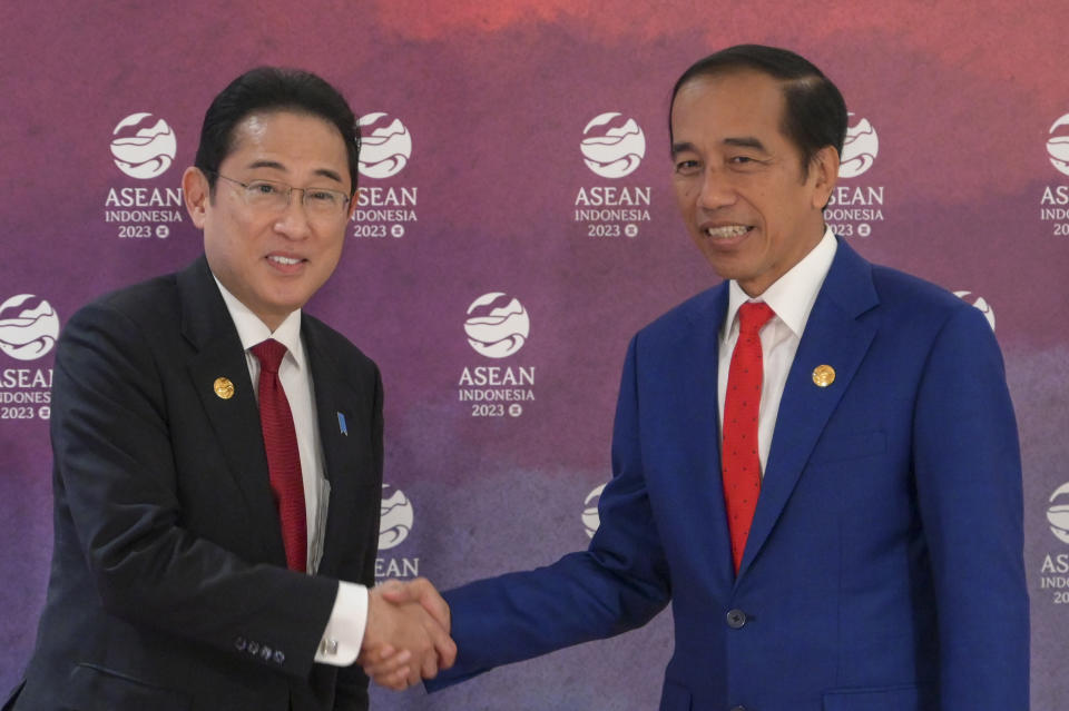 Indonesian President Joko Widodo, right, greets Japan's Prime Minster Fumio Kishida during their bilateral meeting on the sidelines of the Association of Southeast Asian Nations (ASEAN) Summit in Jakarta, Indonesia Thursday, Sept. 7, 2023. (Bay Ismoyo/Pool Photo via AP)