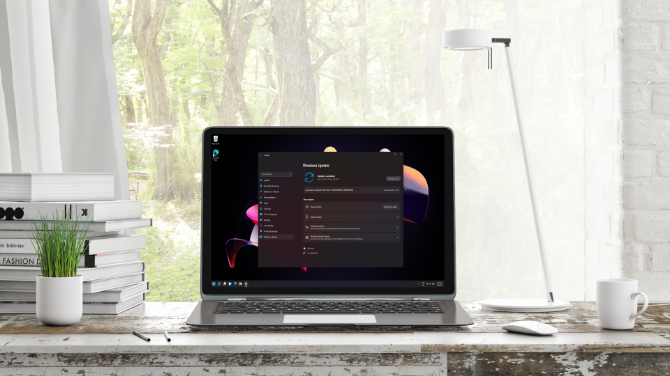 Windows 11 Update showing on laptop in an office