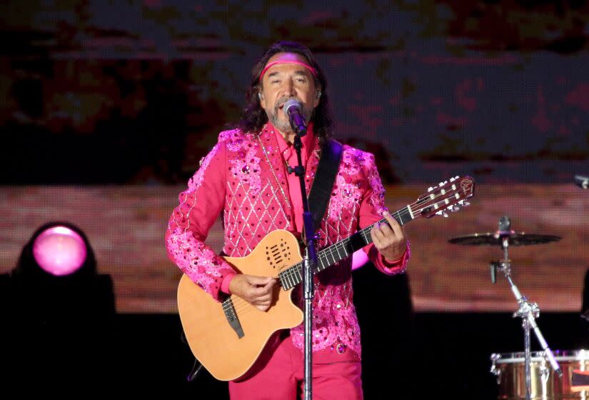 Los Bukis frontman and co-founder Marco Antonio Solis plays with the legendary Mexican grupera band for their Una Historia Cantada Tour at the Los Angeles Coliseum on Thursday, Aug. 18, 2022.