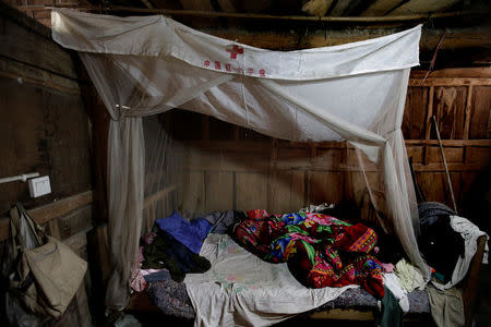 A mosquito net provided by the Chinese Red Cross during the earthquake rescue, still being used by surviving villager Chen Mingyou, hangs in his old house which was heavily damaged in the 2008 Sichuan earthquake, at a village on a mountain in Beichuan county, Sichuan province, China, April 4, 2018. REUTERS/Jason Lee