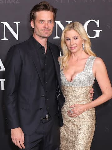 <p>Leon Bennett/Getty</p> Christopher Backus and Mira Sorvino at the premiere of 'Shining Vale' in February 2022.