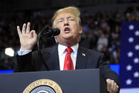 FILE - In this March 28, 2019, file photo, President Donald Trump speaks at a campaign rally in Grand Rapids, Mich. In the campaign for House control, some districts are seeing a fight between Democrats saying they'll protect voters from Republicans willing to take their health coverage away, while GOP candidates are raising specters of rioters imperiling neighborhoods if Democrats win. (AP Photo/Manuel Balce Ceneta, File)