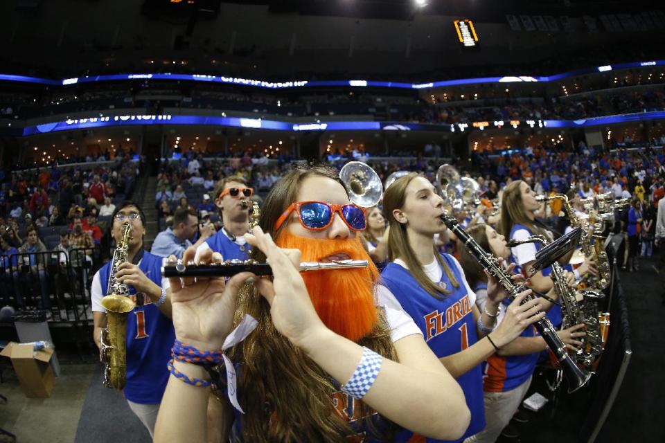 The Florida pep band plays before the first half in a regional semifinal game against UCLA at the NCAA college basketball tournament, Thursday, March 27, 2014, in Memphis, Tenn. (AP Photo/John Bazemore)