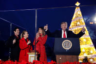 <p>First lady Melania Trump, with President Donald Trump and hosts Dean Cain (L) and Kathie Lee Gifford (2nd L), reacts after she pressed the button to light the tree during the National Christmas Tree lighting ceremony near the White House in Washington, Nov. 30, 2017. (Photo: Jonathan Ernst/Reuters) </p>