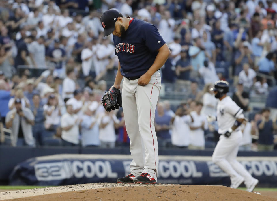 Boston Red Sox's Eduardo Rodriguez stands on the mound as New York Yankees' Gleyber Torres runs the bases after hitting a grand slam during the first inning of a baseball game Friday, Aug. 2, 2019, in New York. (AP Photo/Frank Franklin II)