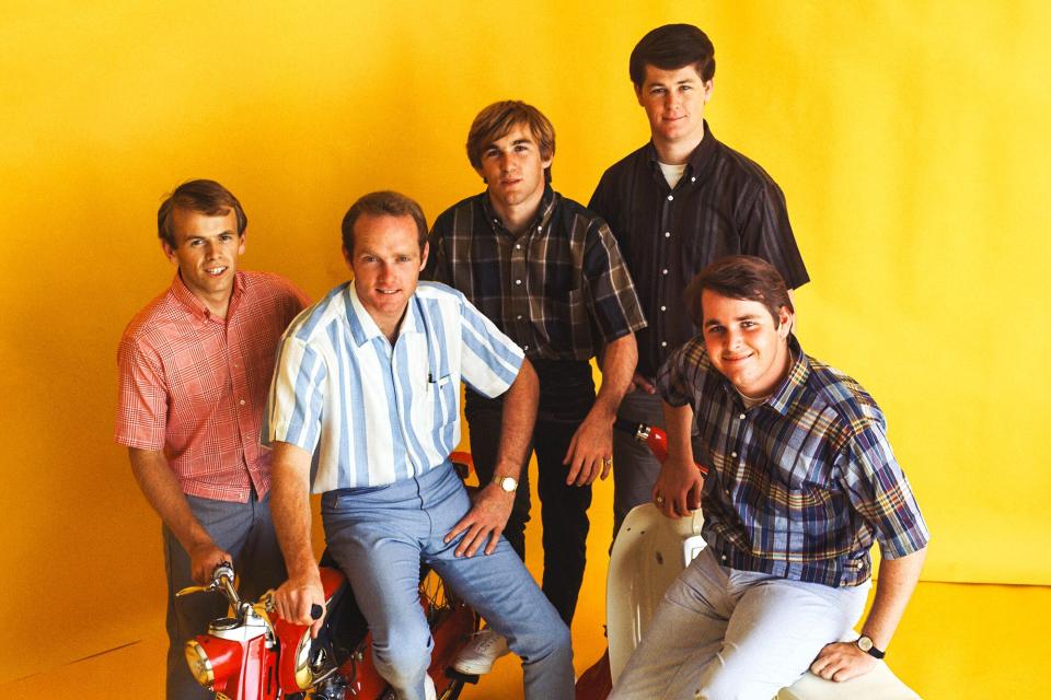 Rock and roll band "The Beach Boys" pose for a portrait with 2 Honda Mo-peds in circa 1964 in Los Angeles, California. (L-R) Al Jardine, Mike Love, Dennis Wilson, Brian Wilson, Carl Wilson.