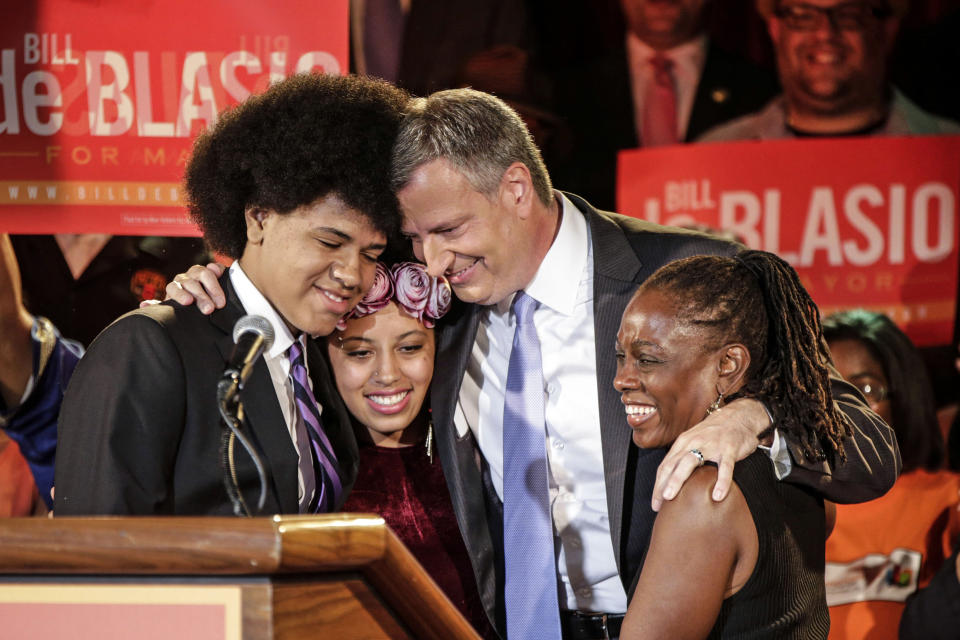 FILE - New York Democratic mayoral candidate Bill de Blasio embraces his son Dante, left, daughter Chiara, second from left, and wife, Chirlane McCray, right, after polls closed in the city's primary election, in New York, Sept. 10, 2013. De Blasio and McCray are separating but not divorcing after 29 years of a marriage that helped lift de Blasio into the mayor's job. (AP Photo/Kathy Willens, File)