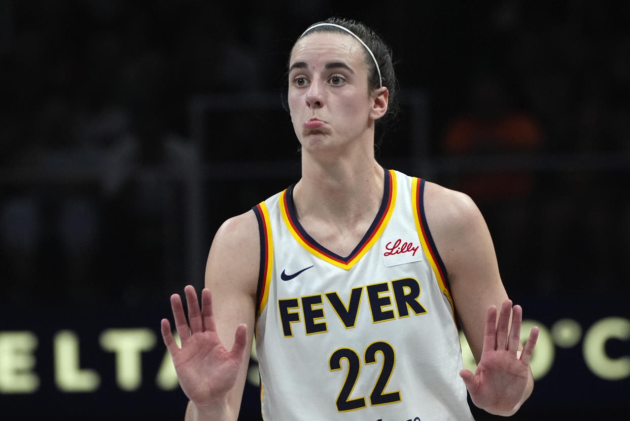 Indiana Fever guard Caitlin Clark reacts during the first half of a WNBA basketball game against the Atlanta Dream on Friday, June 21, 2024, in Atlanta. (AP Photo/John Bazemore)