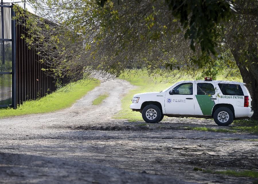 A U.S. Border Patrol agent guards a fence gate along the U.S.-Mexico border, Thursday, Feb. 16, 2017, in Brownsville, Texas. The United States does not have a way to measure how well fencing works to deter illegal crossings from Mexico, according to a report released Thursday, Feb. 16, 2017, by Congress’ main watchdog as President Donald Trump renewed his pledge to build “a great wall” on the border. (Jason Hoekema/The Brownsville Herald via AP)