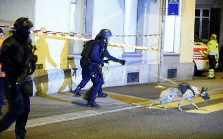 Police stand outside an Islamic center in central Zurich, Switzerland December 19, 2016. REUTERS/Arnd Wiegmann