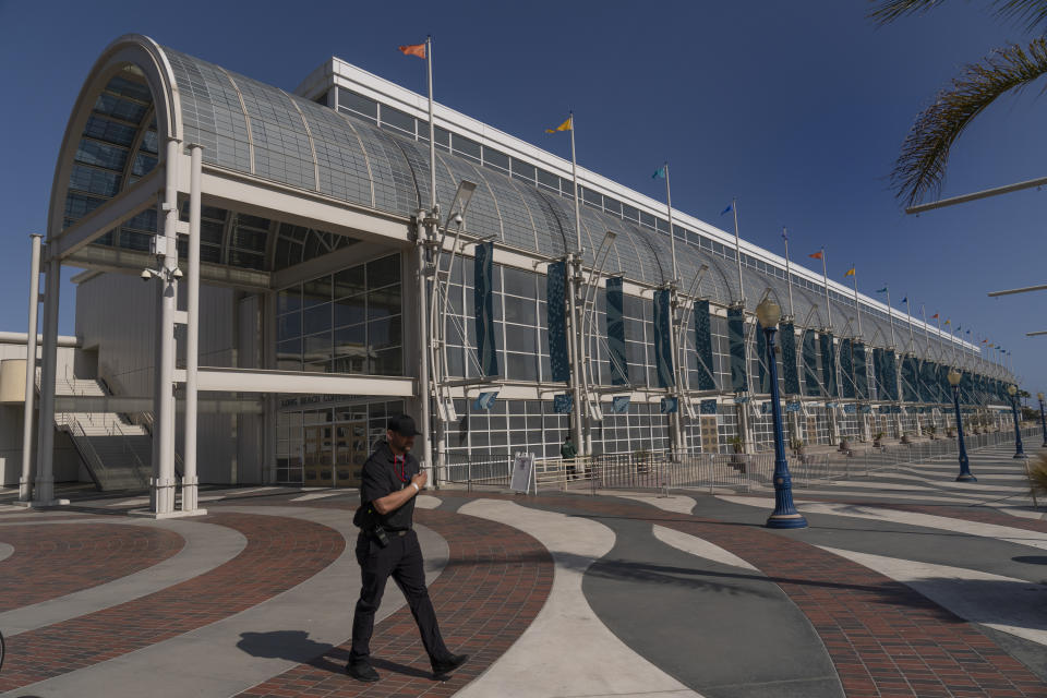 File-This May 22, 2021, file photo shows the Long Beach Convention Center that is being used as a temporary shelter facility for immigrant children in Long Beach, Calif. U.S. Officials are closing four emergency facilities, two in Texas and two in California, set up to house migrant children caught crossing the border alone. But officials, Tuesday, June 29, 2021, cautioned that minors continue to arrive on the southwest border despite the summer heat. (AP Photo/Damian Dovarganes, File)