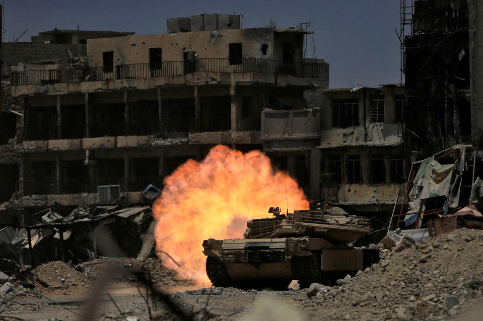 A tank fires at Islamic State militants