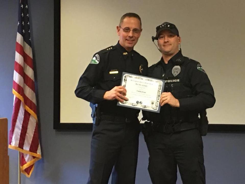 Former Bellingham Police Chief David Doll (left) congratulates Detective Adam (Bo) S. McGinty (right) on his promotion in a Jan. 3, 2018 photo. In June 2023, McGinty became the subject of a department internal affairs investigation and an outside agency criminal investigation. McGinty was fired in mid-August 2023 from the department.