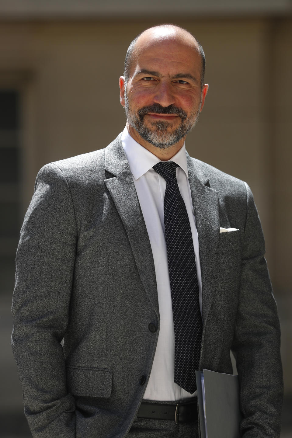 Uber CEO Dara Khosrowshahi poses as he arrives for the Tech for Good summit in Paris, Wednesday, May 15, 2019 in Paris. World leaders and tech bosses meet Wednesday in Paris to discuss ways to prevent social media from spreading deadly ideas. (AP Photo/Thibault Camus)