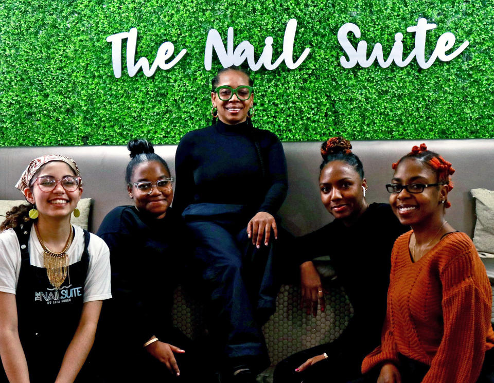 Logan (center) and her staff at the Nail Suite on Feb. 10, 2023, in Harlem