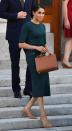 <p>Touching down in Dublin, the royal wore a forest green Givenchy blouse and skirt with tan heels, July 2018.</p>