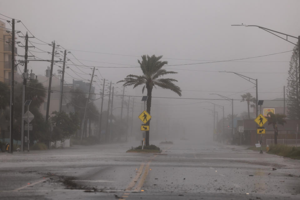 A road is empty of traffic as Hurricane Helene churns offshore on September 26, 2024, in St. Pete Beach, Florida. 