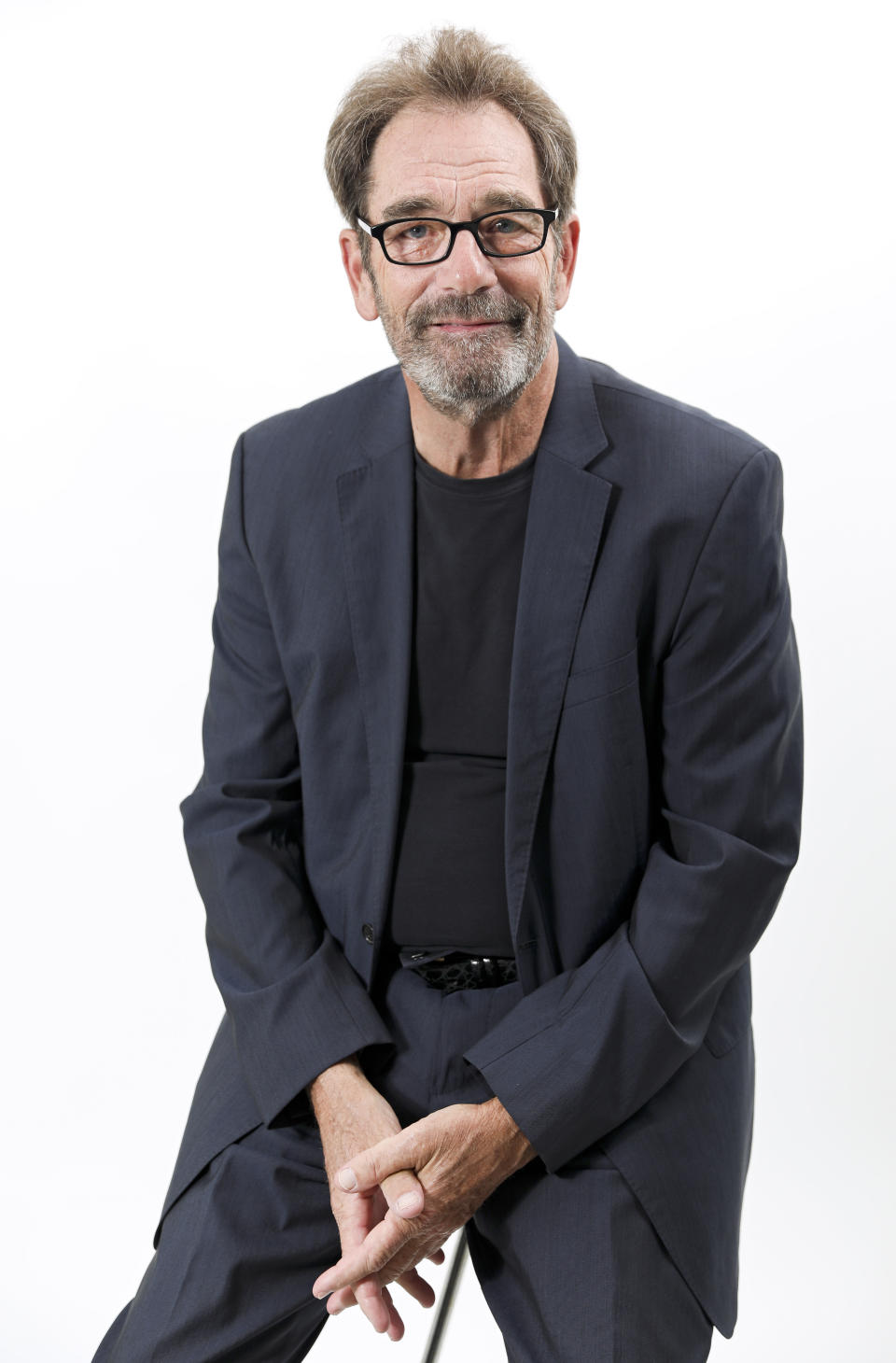 FILE - This Oct. 2, 2019 file photo shows musician Huey Lewis posing for a portrait in New York. The 69-year-old frontman for Huey Lewis & The News has a new album "Weather" out on Feb. 14. (Photo by Brian Ach/Invision/AP, File)