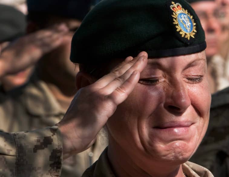 The Canadian Forces’ combat mission in Afghanistan ended in 2011. Here, a tearful Sgt. Renay Groves salutes during the final Remembrance Day ceremony at Kandahar Air Field.