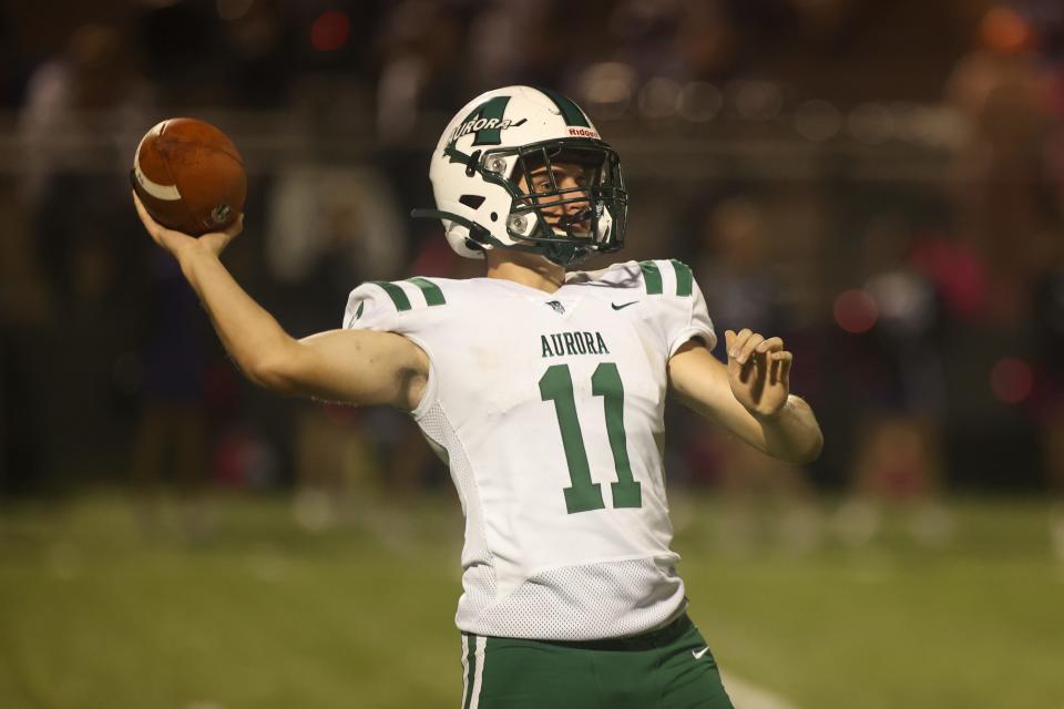 Aurora quarterback Brandon Liepins throws the football against Barberton.