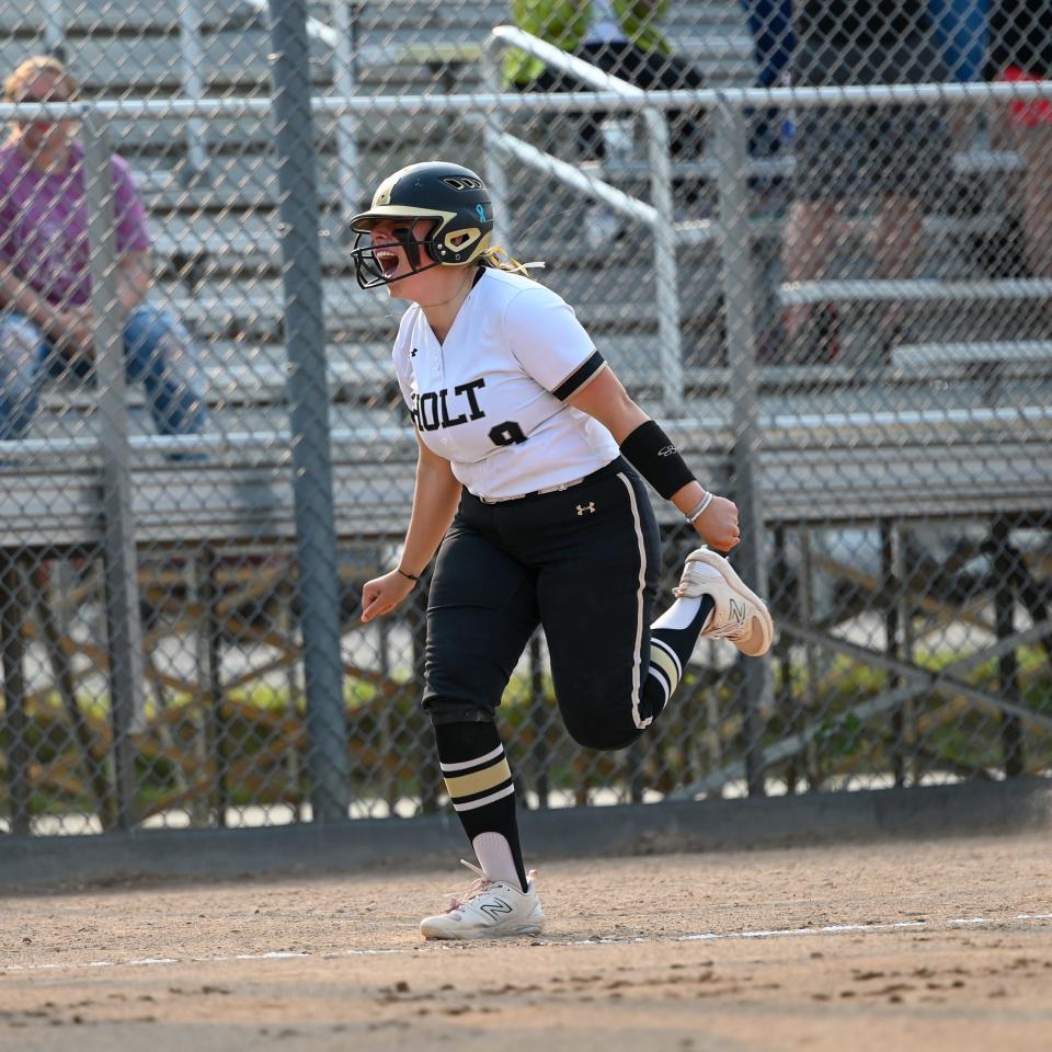 Holt third baseman Kaelyn Rozycki celebrates as she nears home plate following a home run in the second inning in the Rams' game against Waverly in the Greater Lansing Hall of Fame Softball Classic at Ranney Park on May 23, 2023.