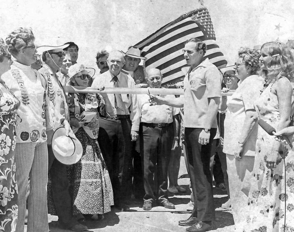 Merced County Supervisor Emory O’Banion, behind the ribbon and wearing a tie, is seen at the Campvention ribbon-cutting ceremony in July 1973.