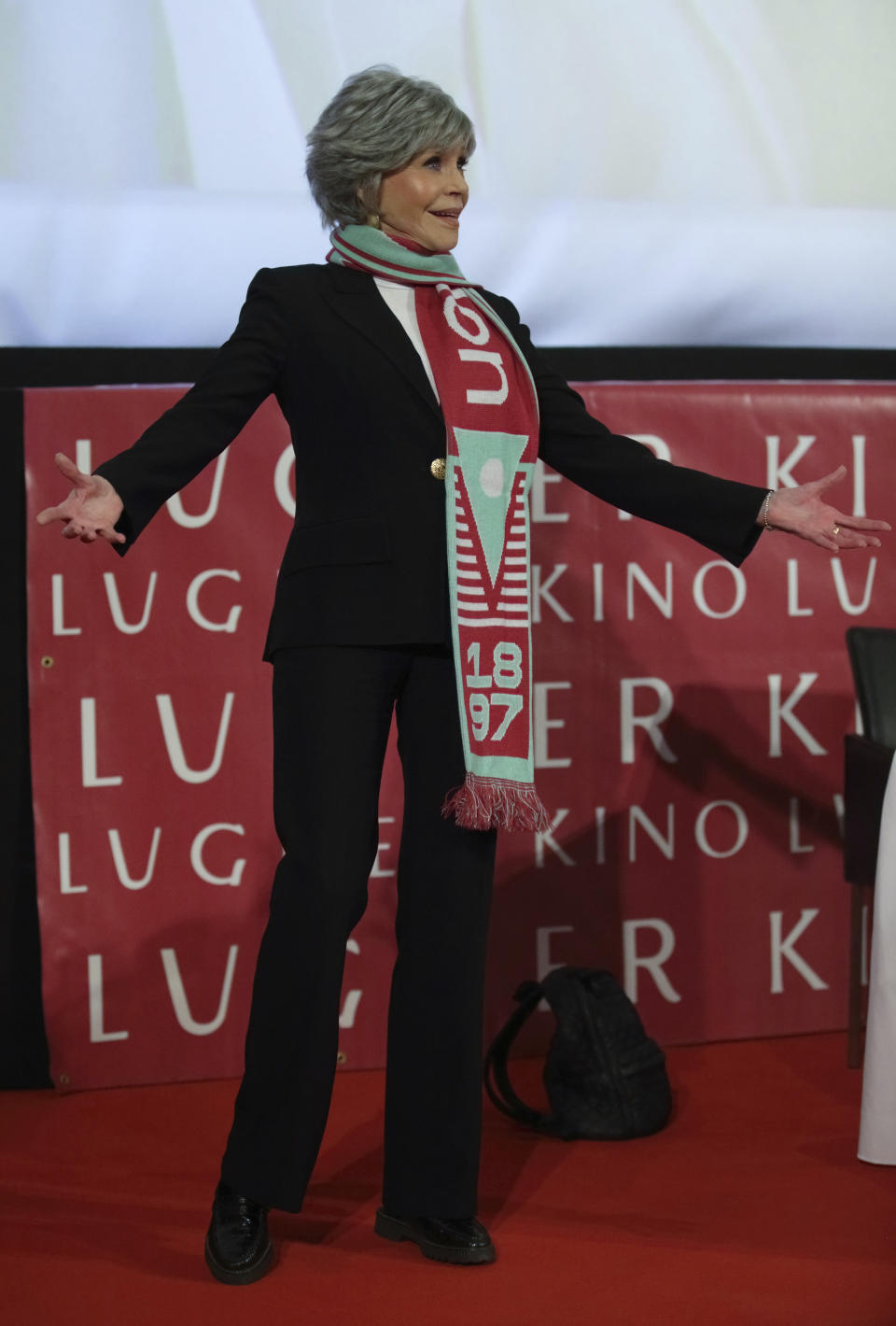 Actress Jane Fonda leaves a joint press conference with her host, businessman Richard Lugner, on the Vienna Opera Ball in Vienna, Austria, Wednesday, Feb. 15, 2023. (AP Photo/Heinz-Peter Bader)