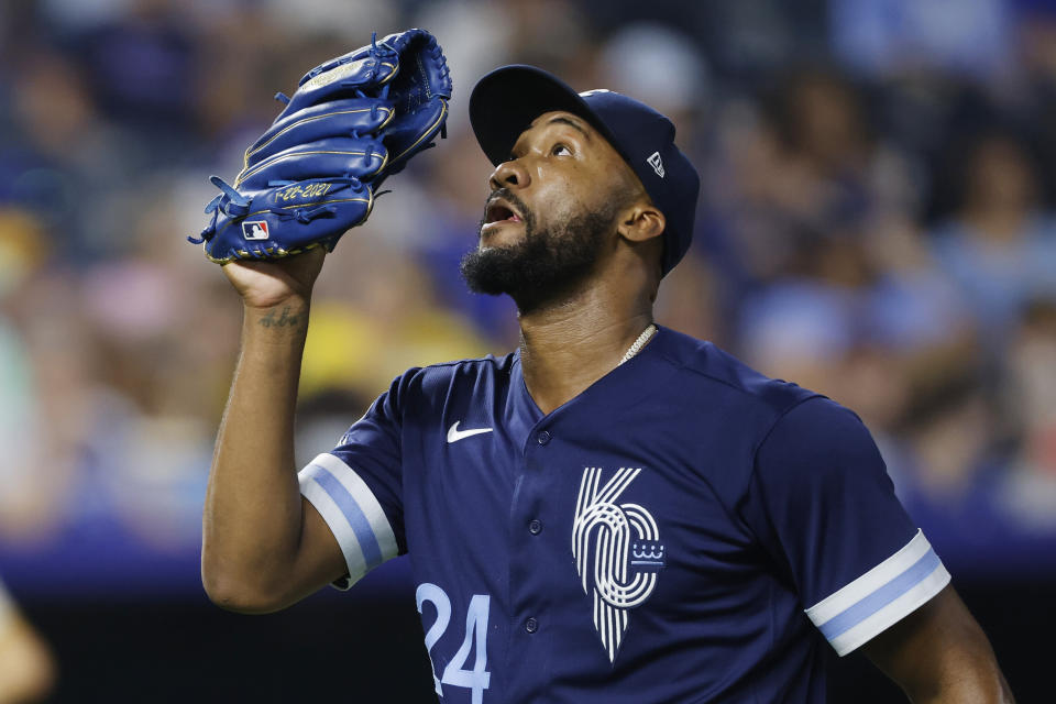 Kansas City Royals relief pitcher Amir Garrett reacts as he walks to the dugout after being taken out during the seventh inning of baseball game against the San Diego Padres in Kansas City, Mo., Friday, Aug. 26, 2022. (AP Photo/Colin E. Braley)