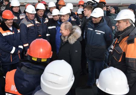 Russian President Vladimir Putin inspects the completed road section of the Crimea Bridge over the Kerch Strait, Crimea, March 14, 2018. Sputnik/Aleksey Nikolskyi/Kremlin via Reuters