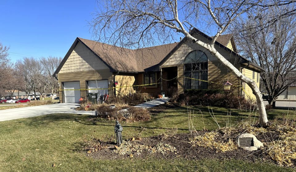 Crime scene tape surrounds the rectory at St. John the Baptist Catholic Church in Fort Calhoun, Neb., Monday, Dec. 11, 2023, one day after a priest was fatally stabbed there during a break-in. (AP Photo/Josh Funk)