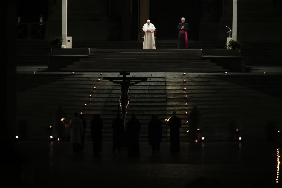 Pope Francis presides over the Via Crucis – or Way of the Cross – ceremony in St. Peter's Square empty of the faithful following Italy's ban on gatherings to contain coronavirus contagion, at the Vatican, Friday, April 10, 2020. (AP Photo/Alessandra Tarantino)