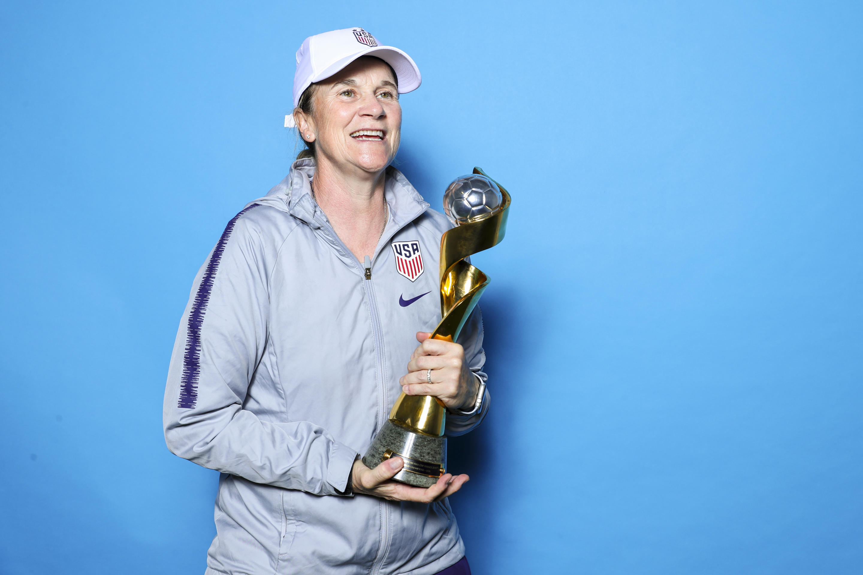 LYON, FRANCE - JULY 07: Coach of the USA, Jill Ellis of the USA poses with the Women's World Cup trophy after the 2019 FIFA Women's World Cup France Final match between The United State of America and The Netherlands at Stade de Lyon on July 07, 2019 in Lyon, France. (Photo by Naomi Baker - FIFA/FIFA via Getty Images)