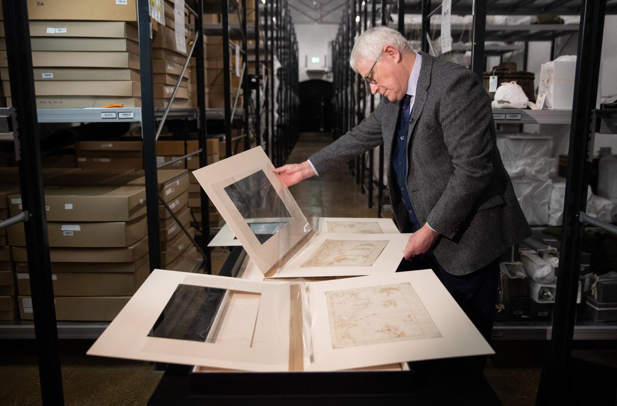 <p>Professor Dominic Tweddle, Director General of the National Museum of the Royal Navy, looks at one of the 'Armada Maps' at Portsmouth Historic Dockyard</p> (PA)