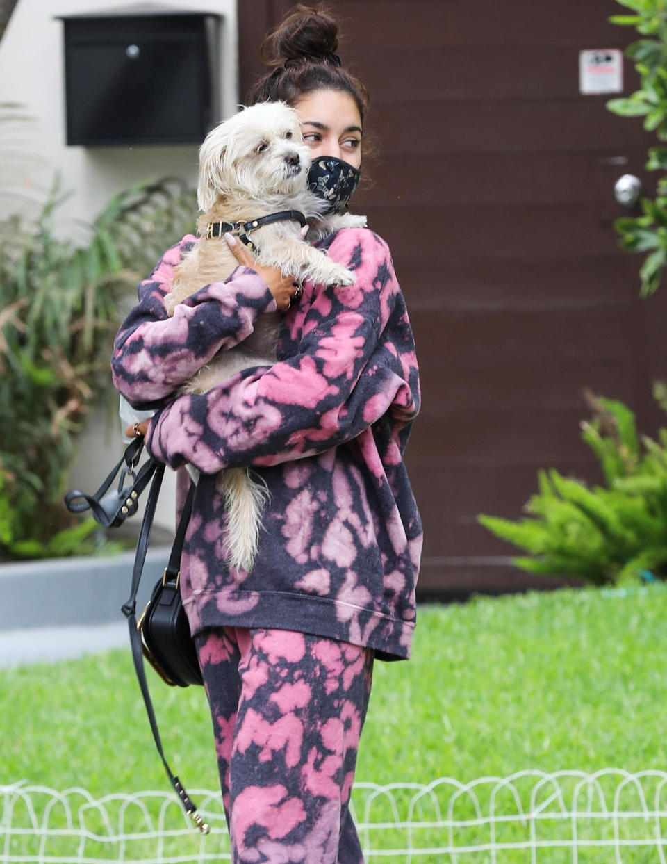 <p>Vanessa Hudgens and her pooch make their way through Beverly Hills after visiting a friend on Wednesday.</p>