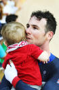 <p>Silver medal cyclist Mark Cavendish of Great Britain celebrates with his daughter after competing in the men’s omnium.</p>