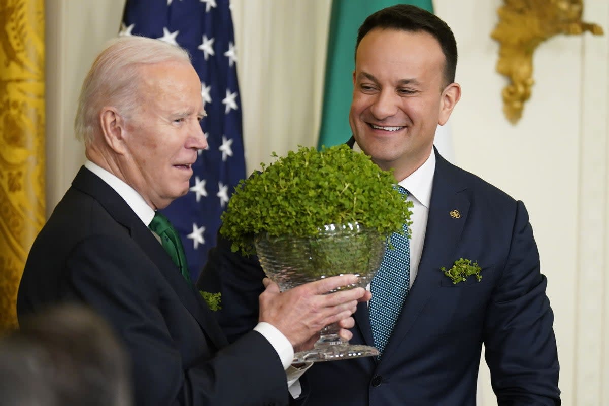 Taoiseach Leo Varadkar presents US President Joe Biden with a bowl of Shamrock last year (Niall Carson/PA) (PA Archive)