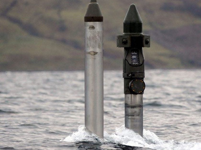 Two large metal periscopes poked a few feet above gray waters