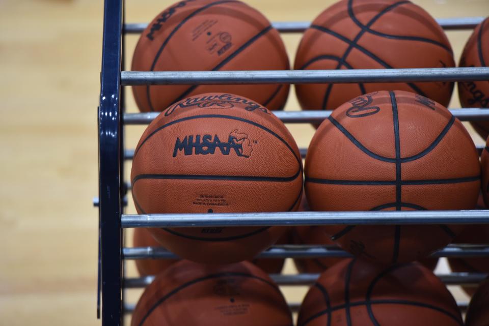 Basketballs sit on a rack in the gymnasium at Marysville High School in Marysville on Friday, Dec. 15, 2023.