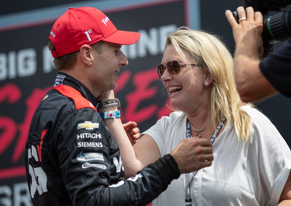Team Penske driver Will Power (12) celebrates with his wife Liz after winning the Big Machine Spiked Coolers Grand Prix on Saturday, Aug. 14, 2021, at Indianapolis Motor Speedway. 