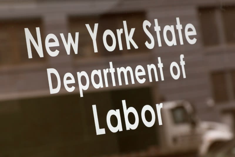 Signage is seen on the entrance of the New York State Department of Labor offices, who closed to the public due to the coronavirus disease (COVID-19) outbreak in the Brooklyn borough of New York City