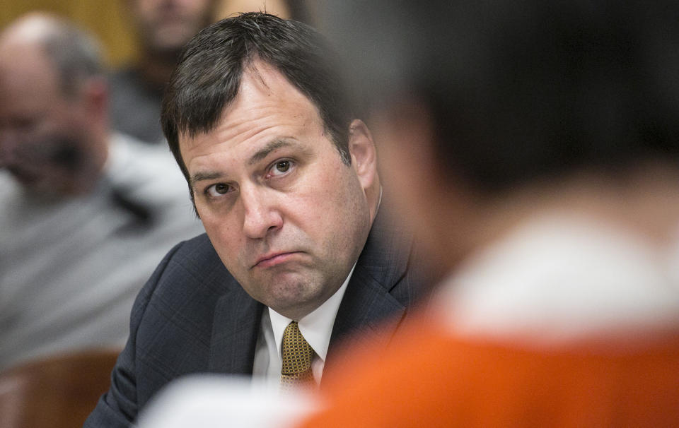 FILE - Sedgwick County District Attorney Marc Bennett looks toward Daniel Perez as Perez is sentenced in Sedgwick District Court in Wichita, Kan., on March 24, 2015. Bennett said this week that the state's "stand your ground law" prevented him from charging the local juvenile center's employees in the death of 17-year-old Cedric Lofton, who'd been restrained on the ground on his stomach, shackled and handcuffed for more than 30 minutes.(AP Photo/The Wichita Eagle, Mike Hutmacher, File)