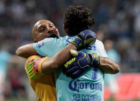 Football Soccer -Monterrey v Pachuca - Mexican first division final soccer match - Tecnologico stadium, Monterrey, Mexico - 29/05/16. Pachuca's goalkeeper Oscar Perez (L) and player Steven Almeida celebrate after winning the Mexican first division against Monterrey. REUTERS/Daniel Becerril