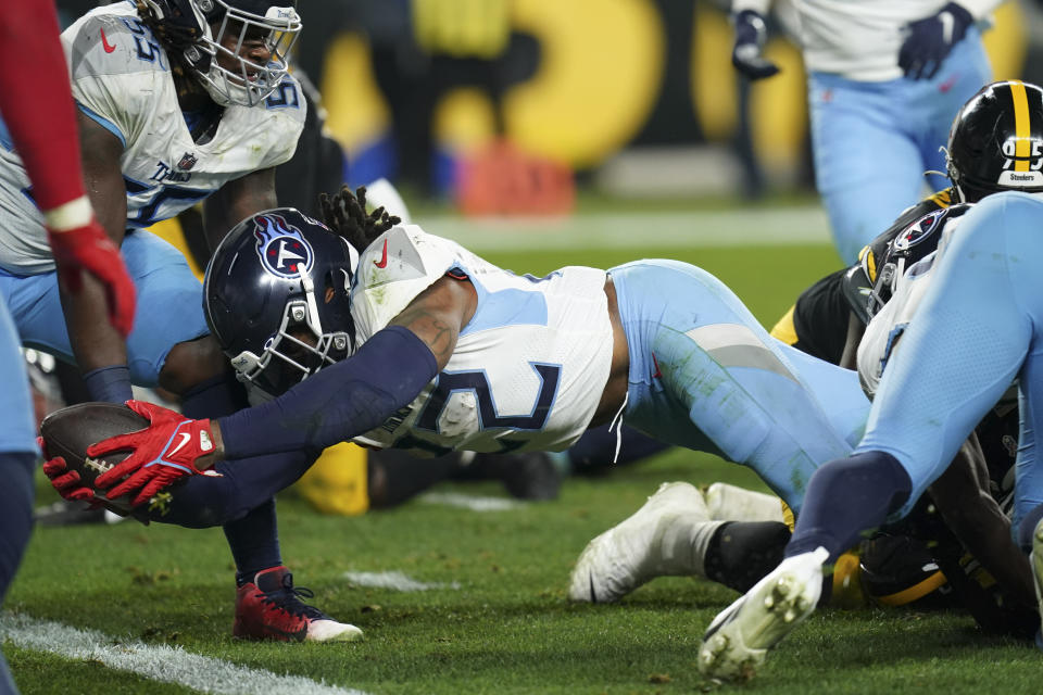 Tennessee Titans running back Derrick Henry (22) dives into the end zone for a touchdown against the Pittsburgh Steelers during the first half of an NFL football game Thursday, Nov. 2, 2023, in Pittsburgh. (AP Photo/Matt Freed)