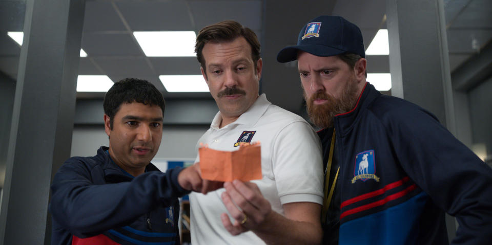 Nick Mohammed, Jason Sudeikis, and Brendan Hunt in 'Ted Lasso,' premiering globally on Friday, August 14, on Apple TV+. 