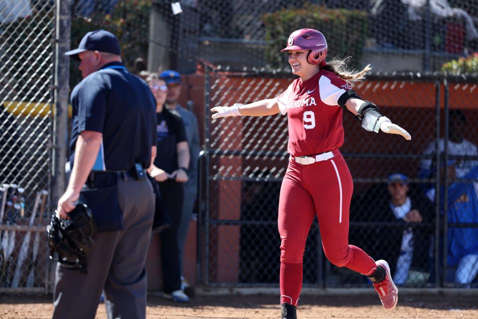 OU catcher Kinzie Hansen celebrates after hitting a home run against UCLA on Feb. 26 at the Mary Nutter Collegiate Classic in Cathedral City, Calif.